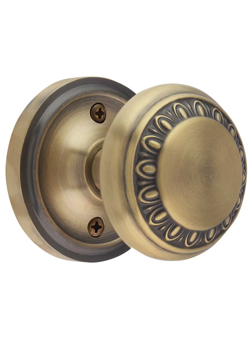 Classic Rosette Door Set with Ovolo Knobs in Antique Brass.